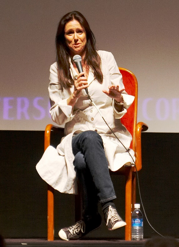 Photo of Julie Taymor seated speaking with microphone